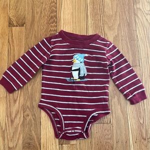 Maroon and gray striped onesie with skiing penguin on the front.  EUC!